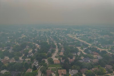 Air Quality health impact Image of Suburban Neighborhood with Wild Fire Smoke
